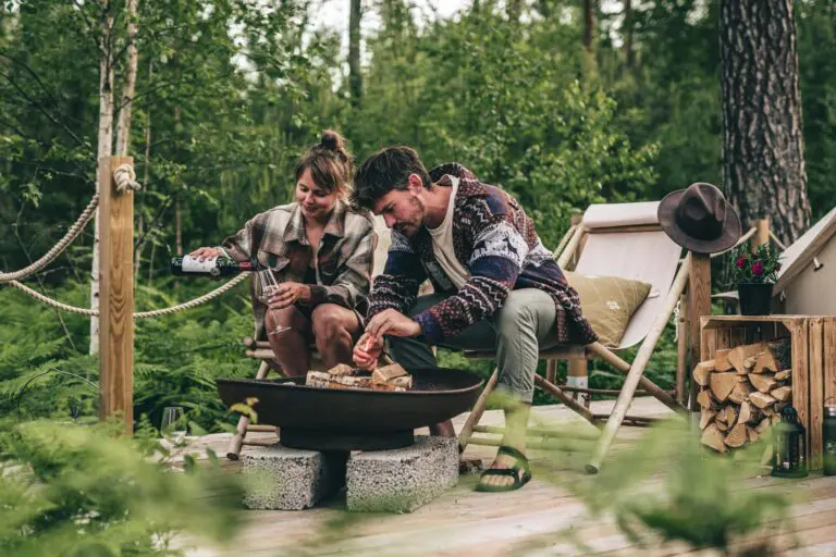 man and woman by the campfire